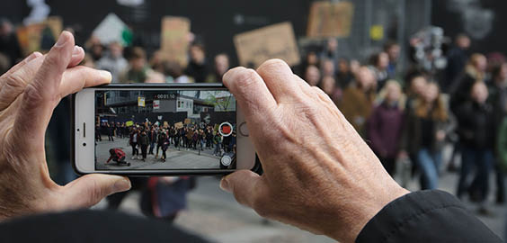 a hand holding a cell phone