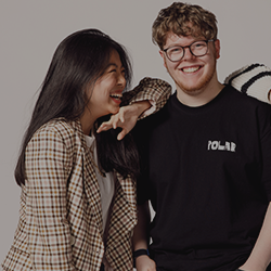 Two Northumbria University students laughing 