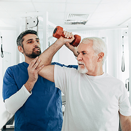 Man on the starting blocks of a running tracks