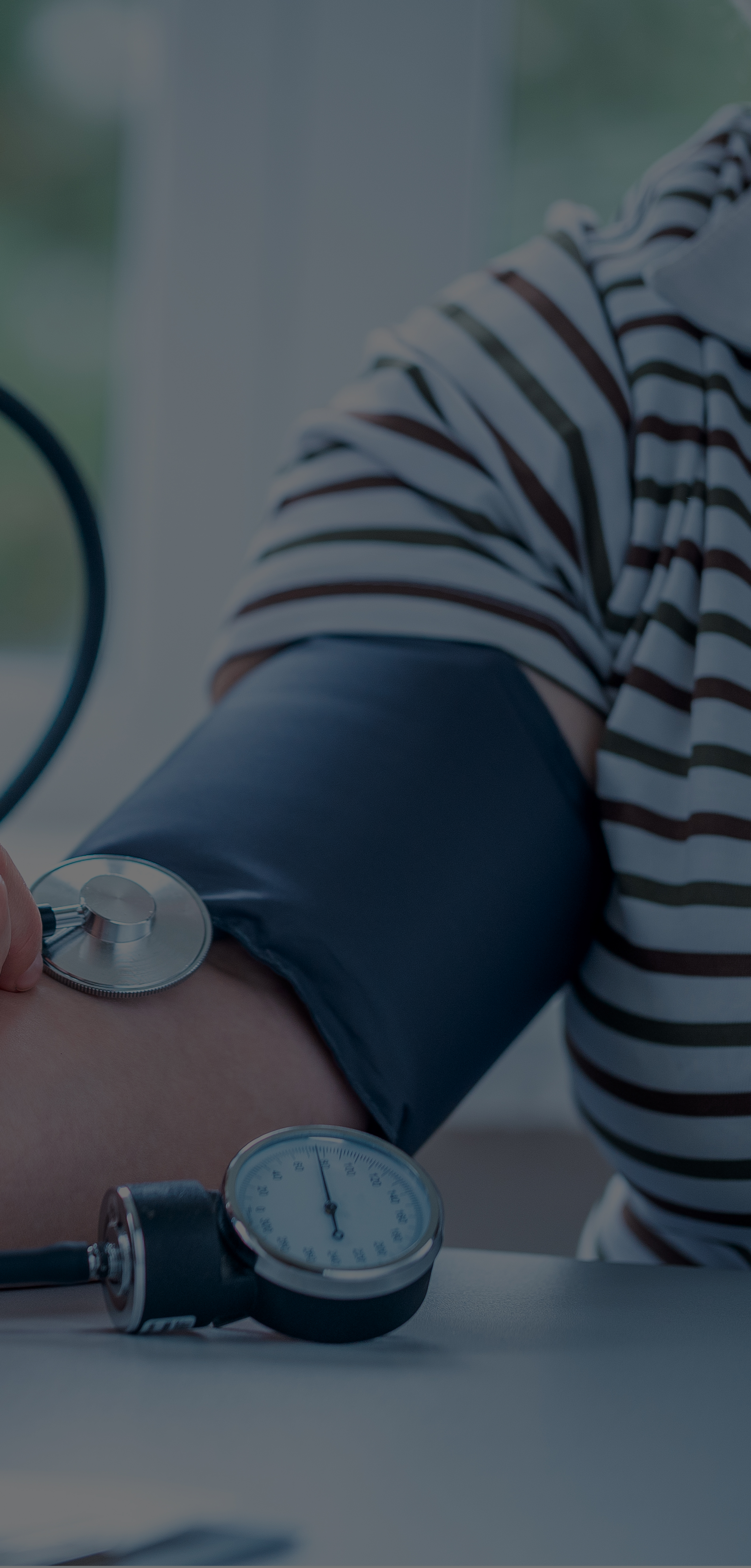 Blood pressure apparatus on a patients arm 