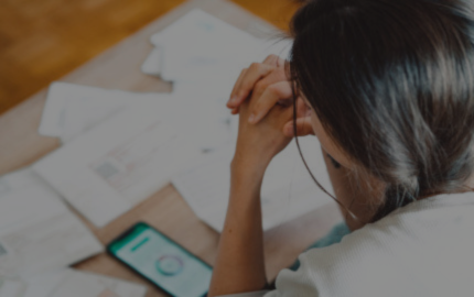 person with head in hands