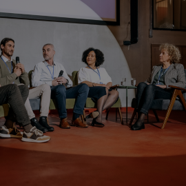 People at an event speaking