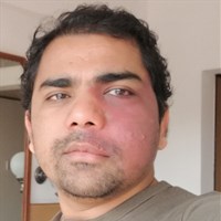 Picture of academic looking at camera