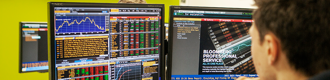 Close-up of a student using a computer in the Business School's Bloomberg Trading Suite.