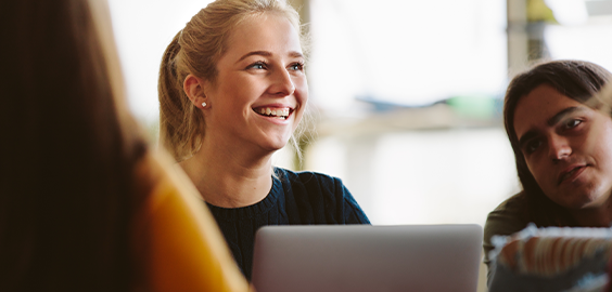 undergraduate girl smiling upwards