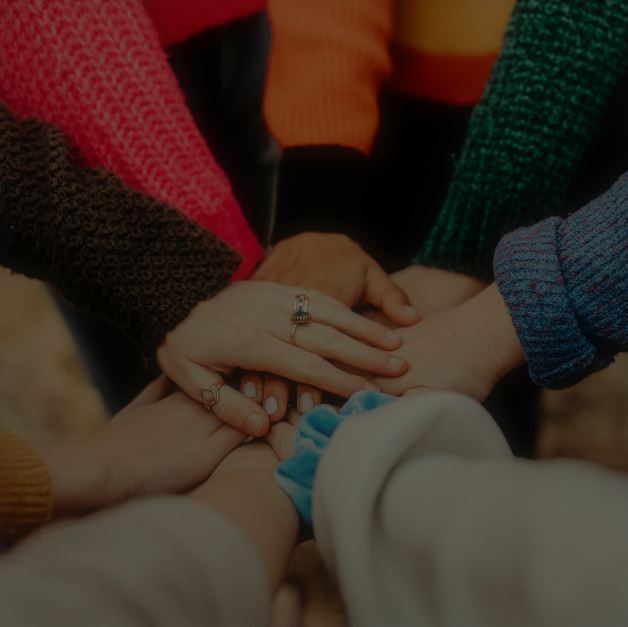 People-in-sweaters-holding-hands