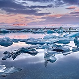 a group of clouds in the sky over a body of water