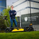 a man riding on the back of a truck