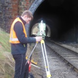 a man standing next to a building