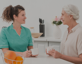 Nurse talking to elderly patient