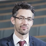 a man wearing a suit and tie