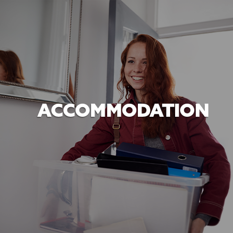 Student carrying box, with white text 'Accommodation' 