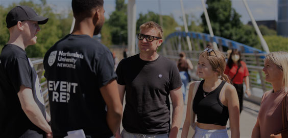 A prospective student with their two parents, talking with two Northumbria University Open Day Event Reps