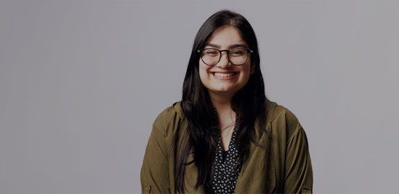 Student stood smiling