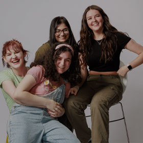 Four Smiling Students