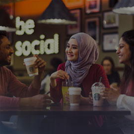 Male and female student drinking a coffee in the Habita bar and restaurant within the Northumbria Students Union