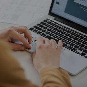 Person typing on laptop