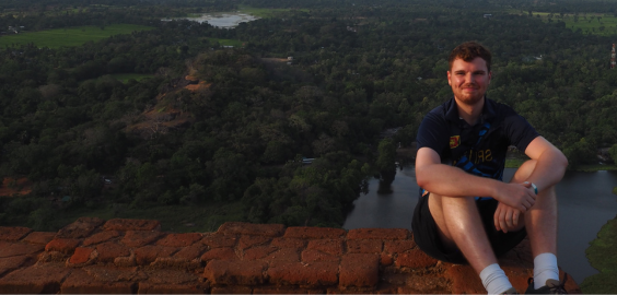 A man sitting on a hill