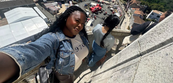 A selfie of a girl on a balcony