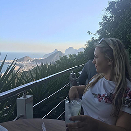 a group of people standing on top of a mountain
