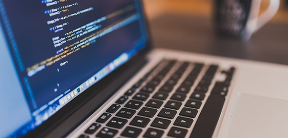 a close up of an open laptop computer sitting on top of a table
