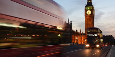 a clock tower lit up at night