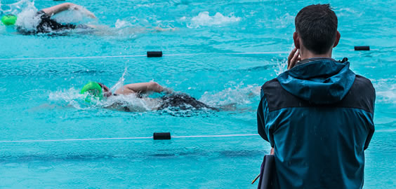 a group of people swimming in the water