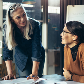 a group of people sitting at a table