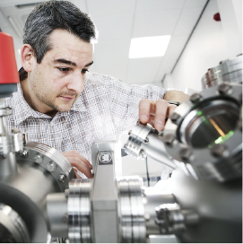 Researcher using equipment in laboratory
