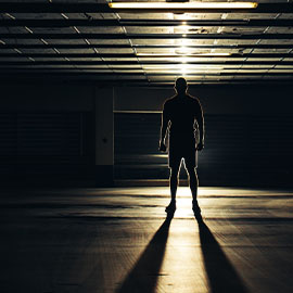 Image of a person standing in a dark room
