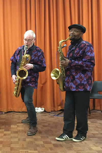 a group of people standing in front of a microphone