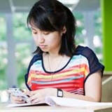 a girl sitting on a table
