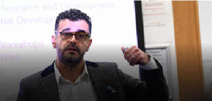 man pointing at a screen