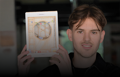 man holding up an award