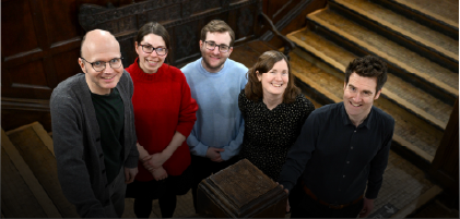group of people smiling to camera