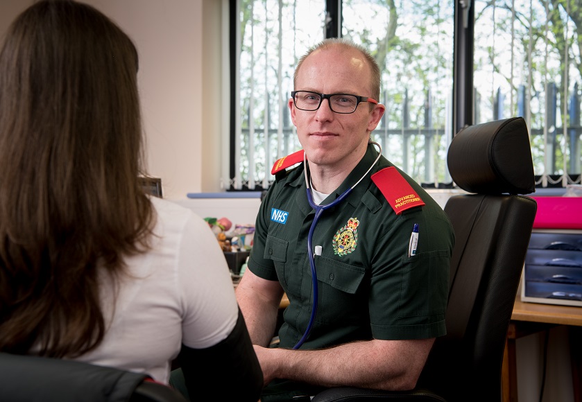 a man and a woman looking at the camera