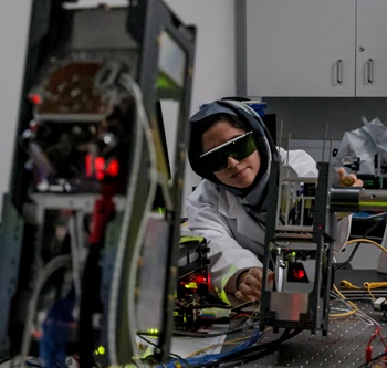 Caption:Northumbria's Dr Rida Zia-ul-Mustafa, Postdoctoral Research Associate in Free-Space, pictured testing one of the CubeSats.