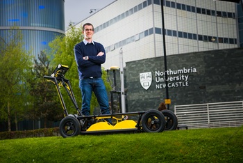 caption:Dr Craig Warren is pictured with a Ground Penetrating Radar (GPR) system manufactured by Sensors & Software. The gprMax software can be used to inform interpretations of GPR data from systems such as this.