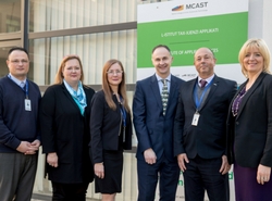 a group of people posing for the camera