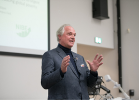 a person standing in front of a mirror posing for the camera