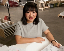 a girl sitting on a table
