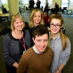 a group of people posing for the camera