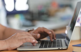 a person using a laptop computer