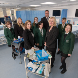 From left to right: Natalie Winchester, Subject Lead Health and Social Care and Post-16 Raising Standard Leader at Bede Academy, Dr Julie Derbyshire – Director of Apprenticeships and Assistant Professor in Nursing at Northumbria University, Andrew Thelwell – Principal at Bede Academy, Professor Alison Machin, Head of Department of Nursing, Midwifery and Health at Northumbria University and pupils from Bede Academy.