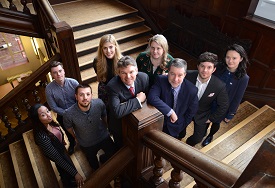 a group of people sitting posing for the camera