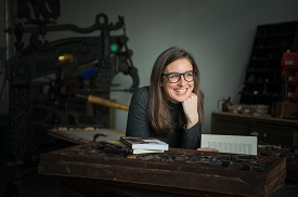 a person standing in front of a computer