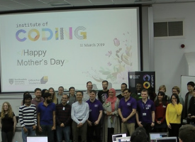 a group of people standing in front of a crowd