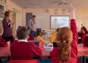 a group of people sitting at a table