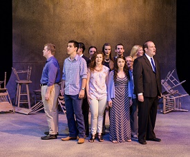 a group of people standing in front of a crowd posing for the camera