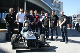 a group of people standing in front of a building